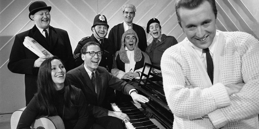 The Frost Report. Image shows left to right: Nicholas Smith, Julie Felix, Tom Lehrer, Ronnie Barker, John Cleese, Ronnie Corbett, Nicky Henson, David Frost. Credit: BBC