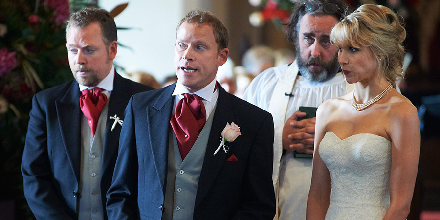 The Wedding Video. Image shows from L to R: Raif (Rufus Hound), Tim (Robert Webb), Reverend Dobbs (Angus Barnett), Saskia (Lucy Punch). Copyright: Timeless Films