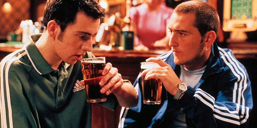 Two Pints Of Lager And A Packet Of Crisps. Image shows from L to R: Jonny Keogh (Ralf Little), Gary 'Gaz' Wilkinson (Will Mellor). Copyright: BBC