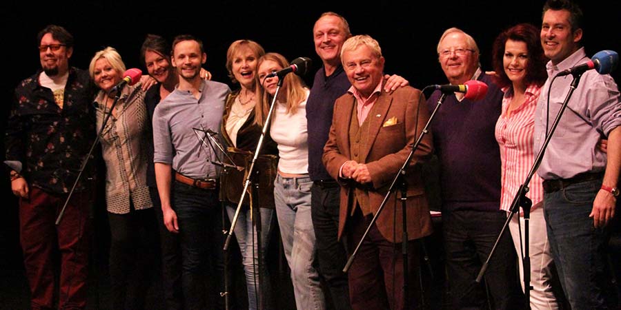 The full cast of the 2019 Up Pompeii! audio play. Image shows from L to R: Barnaby Eaton-Jones, Camille Coduri, Jilly Breeze, Jack Lane, Madeline Smith, Rosa Coduri, David Benson, Frazer Hines, Tim Brooke-Taylor, Cleo Rocos, Ben Perkins. Copyright: Kim Jones