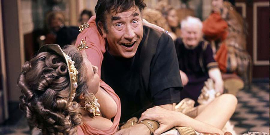 Up Pompeii. Image shows from L to R: Ammonia (Barbara Murray), Lurcio (Frankie Howerd), Ludicrus Sextus (Michael Hordern). Copyright: Associated London Films Limited