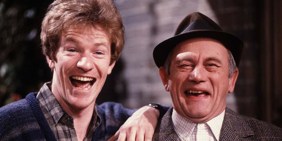 Up The Elephant And Round The Castle. Image shows from L to R: Jim London (Jim Davidson), Dad (John Bardon). Copyright: Thames Television