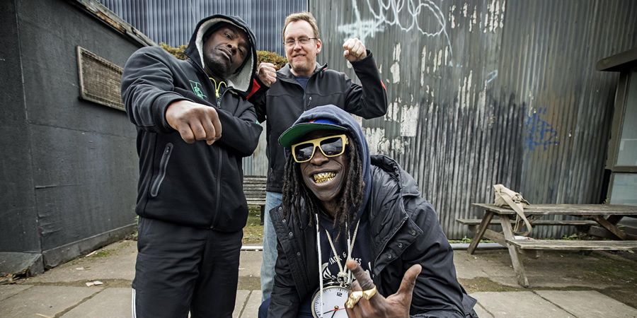 Urban Myths: Public Enemy (feat. Kev Wells). Image shows from L to R: Chuck D (Paterson Joseph), Kev Wells (Philip Glenister), Flavor Flav (Abdul Salis)