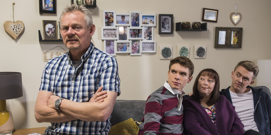 Warren. Image shows from L to R: Warren Thompson (Martin Clunes), Danny (Oscar Morgan), Anne (Lisa Millett), Charlie (Tim Preston). Copyright: Hat Trick Productions