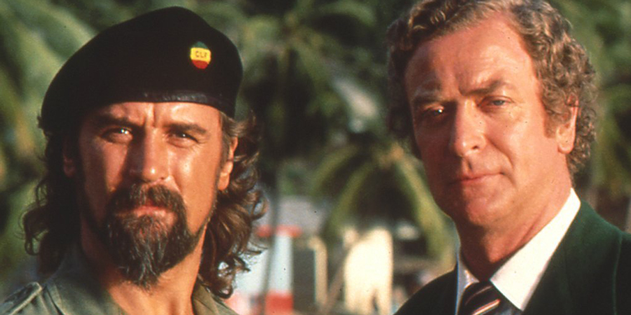 Water. Image shows from L to R: Delgado (Billy Connolly), Governor Baxter Thwaites (Michael Caine). Copyright: Hand Made Films