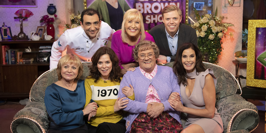 All Round To Mrs. Brown's. Image shows from L to R: Julie Friel, Aly Mahmoud, Anna Friel, Cathy Brown (Jennifer Gibney), Mrs Brown (Brendan O'Carroll), Rob Beckett, Teri Hatcher