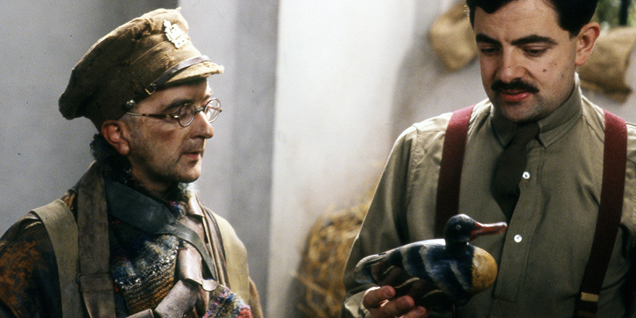 Blackadder. Image shows left to right: Baldrick (Tony Robinson), Captain Edmund Blackadder (Rowan Atkinson). Credit: BBC