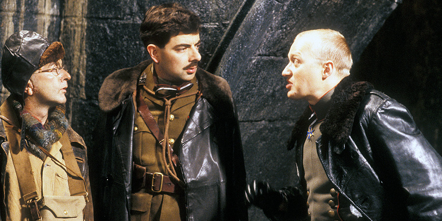 Blackadder. Image shows left to right: Baldrick (Tony Robinson), Captain Edmund Blackadder (Rowan Atkinson), Baron Von Richthoven (Adrian Edmondson). Credit: BBC Blackadder. Image shows left to right: Baldrick (Tony Robinson), Captain Edmund Blackadder (Rowan Atkinson), Baron Von Richthoven (Adrian Edmondson). Credit: BBC