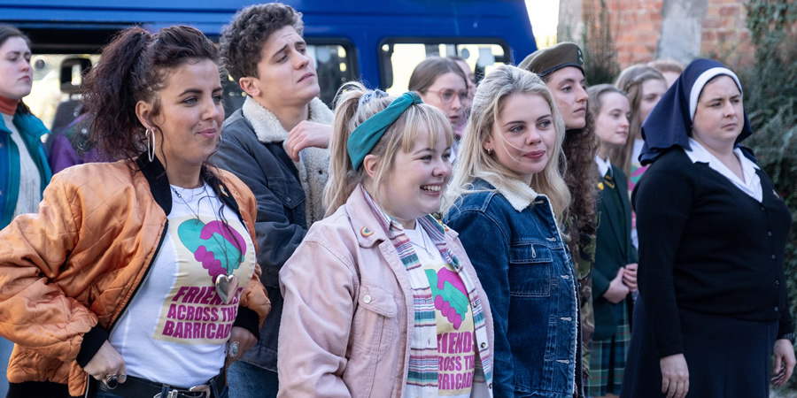 Derry Girls. Image shows from L to R: Michelle Mallon (Jamie-Lee O'Donnell), James Maguire (Dylan Llewellyn), Clare Devlin (Nicola Coughlan), Erin Quinn (Saoirse-Monica Jackson), Orla McCool (Louisa Harland), Sister Michael (Siobhán McSweeney). Copyright: Hat Trick Productions