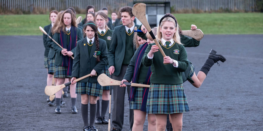 Derry Girls. Image shows from L to R: Jenny Joyce (Leah O'Rourke), James Maguire (Dylan Llewellyn), Erin Quinn (Saoirse-Monica Jackson). Copyright: Hat Trick Productions