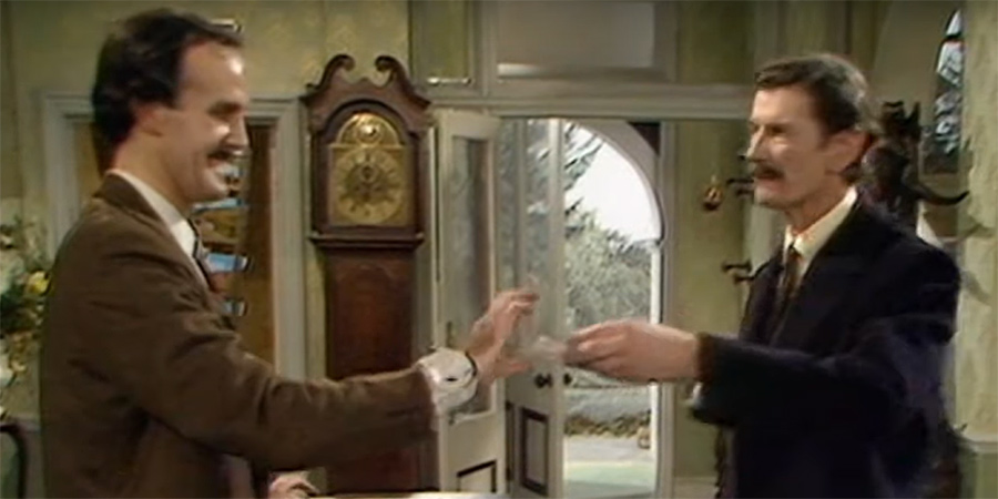 Fawlty Towers. Image shows from L to R: Basil Fawlty (John Cleese), Lord Melbury (Michael Gwynn)