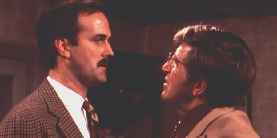Fawlty Towers. Image shows left to right: Basil Fawlty (John Cleese), Mr Hamilton (Bruce Boa). Credit: BBC