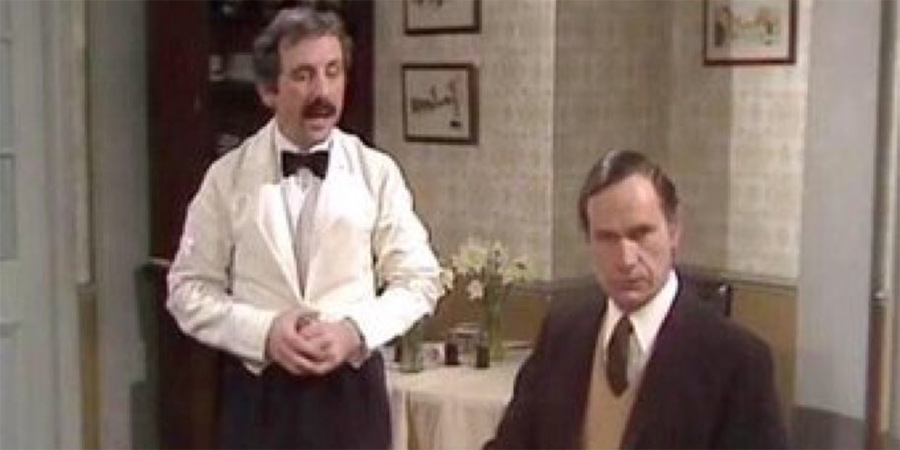 Fawlty Towers. Image shows from L to R: Manuel (Andrew Sachs), Dr Price (Geoffrey Palmer). Copyright: BBC