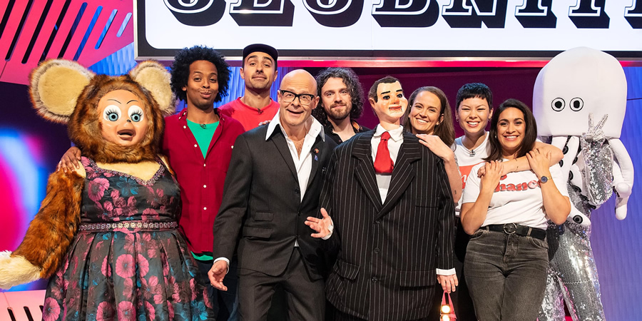 Harry Hill's ClubNite. Image shows from L to R: Mo Omar, Jamie Demetriou, Harry Hill, Alfie Brown, Zoe Coombs Marr, Anna Leong Brophy, Emily Lloyd Saini. Copyright: Nit TV