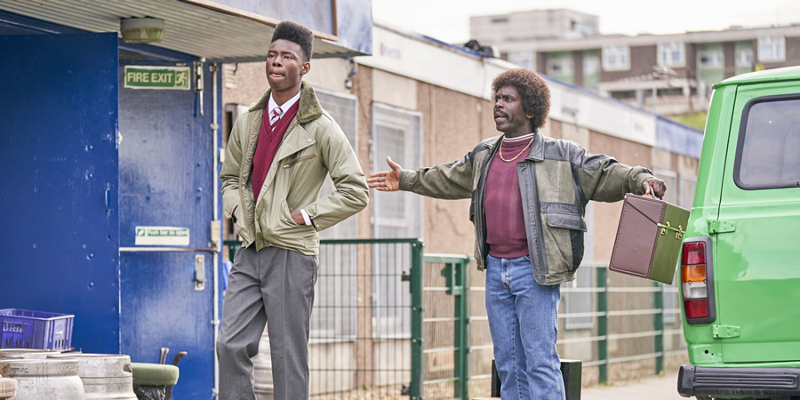 In The Long Run. Image shows from L to R: Singing Boy (Malaki Paul), Valentine (Jimmy Akingbola)