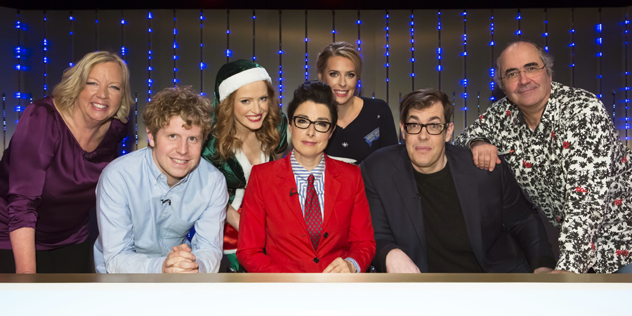 Insert Name Here. Image shows from L to R: Deborah Meaden, Josh Widdicombe, Kate Williams, Sue Perkins, Sara Pascoe, Richard Osman, Danny Baker