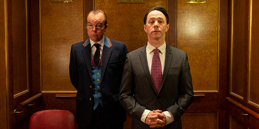 Inside No. 9. Image shows from L to R: Lift Attendant (Steve Pemberton), Urban Bedford (Reece Shearsmith)