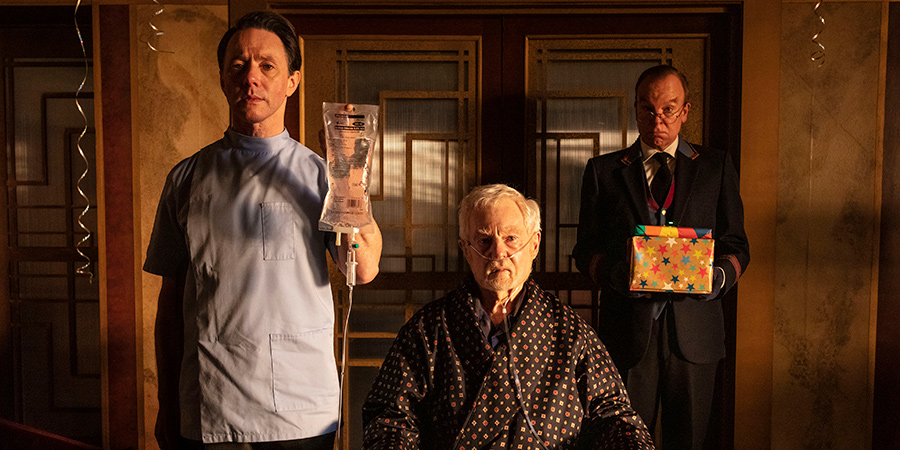 Inside No. 9. Image shows from L to R: Urban Bedford (Reece Shearsmith), Webster (Derek Jacobi), Lift Attendant (Steve Pemberton)