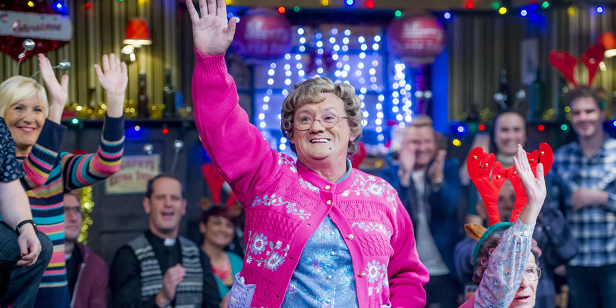 Mrs. Brown's Boys. Image shows from L to R: Cathy Brown (Jennifer Gibney), Father Damien (Conor Moloney), Maria Nicholson / Brown (Fiona O'Carroll), Agnes Brown (Brendan O'Carroll), Dino Doyle (Gary Hollywood), Winnie McGoogan (Eilish O'Carroll)