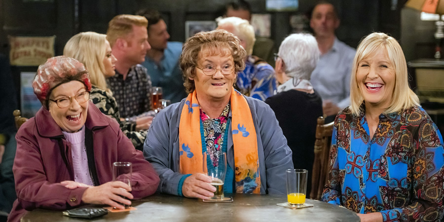 Mrs. Brown's Boys. Image shows from L to R: Winnie McGoogan (Eilish O'Carroll), Agnes Brown (Brendan O'Carroll), Cathy Brown (Jennifer Gibney)