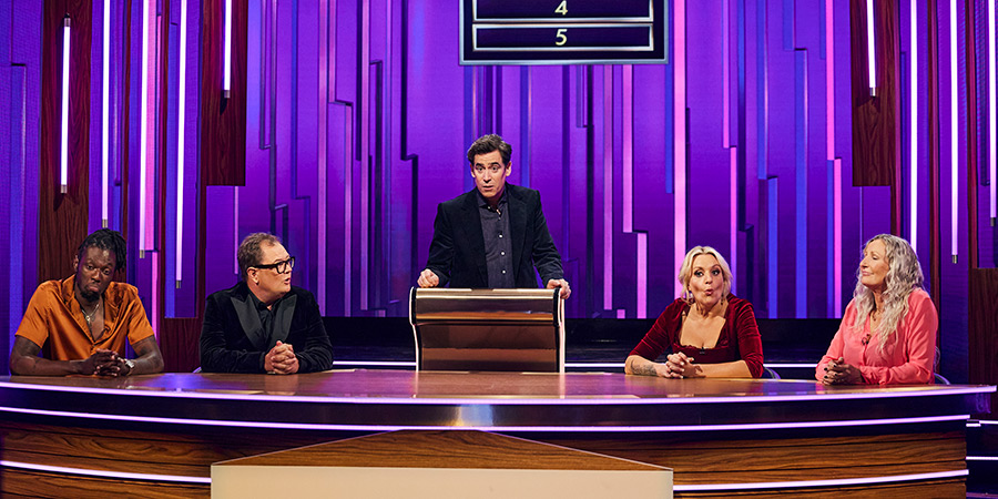 Password. Image shows left to right: Alan Carr, Stephen Mangan, Daisy May Cooper