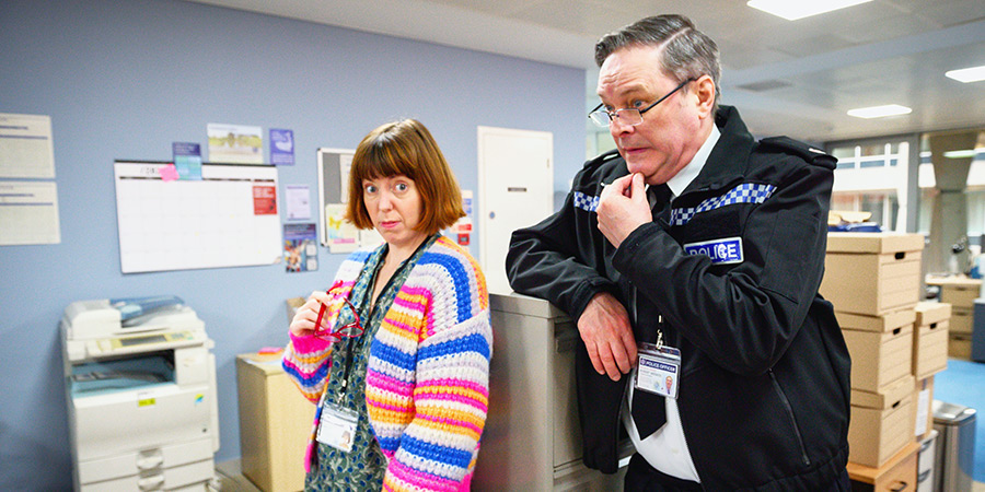 Piglets. Image shows left to right: Melanie (Rebecca Humphries), Superintendent Bob Weekes (Mark Heap)