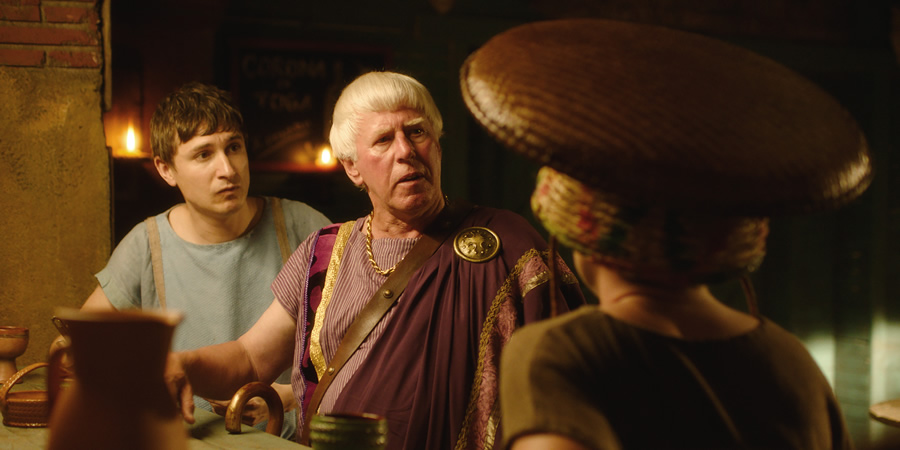 Plebs. Image shows from L to R: Marcus (Tom Rosenthal), Severus (Phil Davis). Copyright: RISE Films