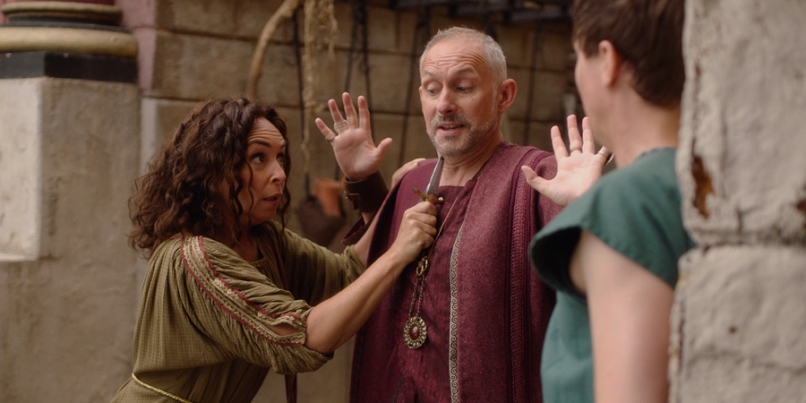 Plebs. Image shows from L to R: Sylvia (Samantha Spiro), Landlord (Karl Theobald), Marcus (Tom Rosenthal). Copyright: RISE Films