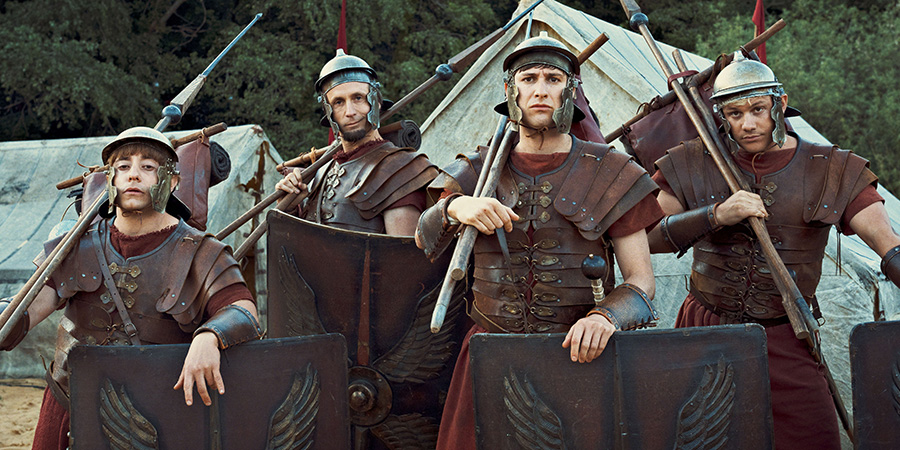 Plebs. Image shows left to right: Grumio (Ryan Sampson), Aurelius (Tom Basden), Marcus (Tom Rosenthal), Jason (Jon Pointing). Credit: RISE Films