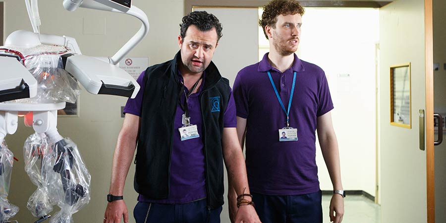 Porters. Image shows from L to R: Anthony De La Mer (Daniel Mays), Simon Porter (Edward Easton)