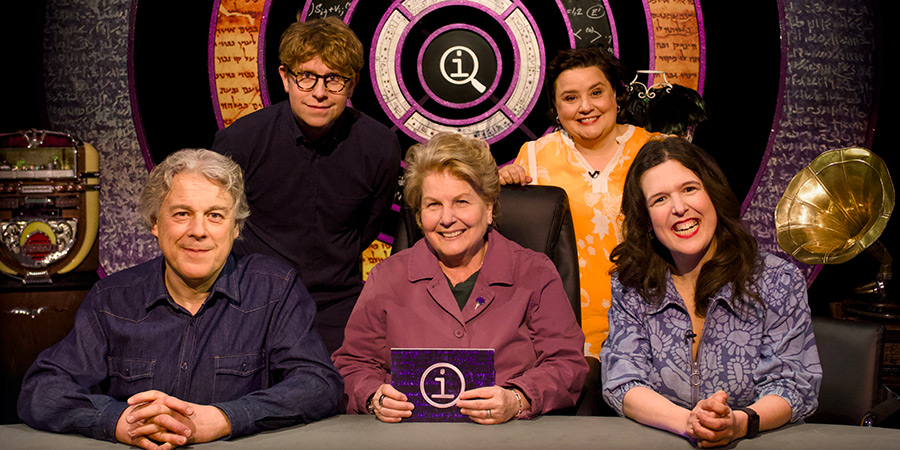 QI. Image shows left to right: Alan Davies, Josh Widdicombe, Sandi Toksvig, Susan Calman, Rosie Jones