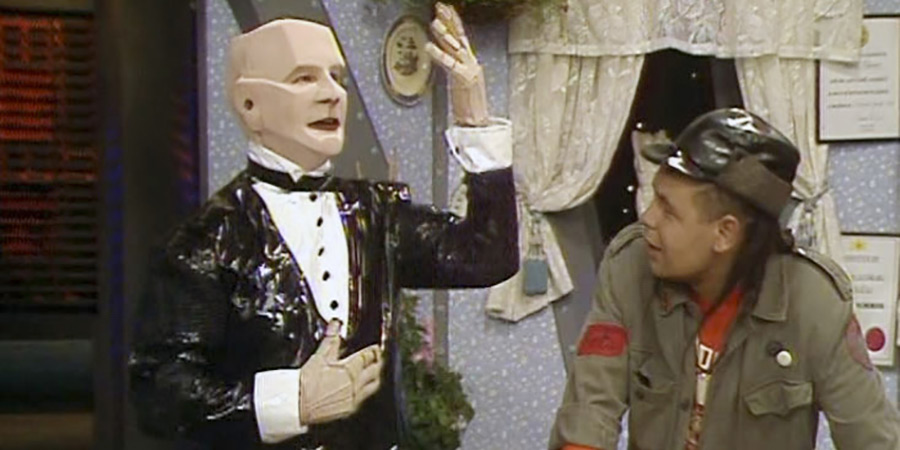 Red Dwarf. Image shows left to right: Kryten (David Ross), Lister (Craig Charles)