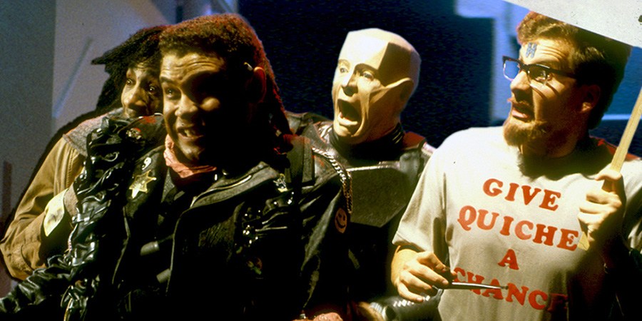 Red Dwarf. Image shows left to right: Cat (Danny John-Jules), Lister (Craig Charles), Kryten (Robert Llewellyn), Rimmer (Chris Barrie). Credit: BBC