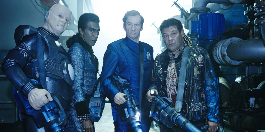 Red Dwarf. Image shows from L to R: Kryten (Robert Llewellyn), Cat (Danny John-Jules), Rimmer (Chris Barrie), Lister (Craig Charles)