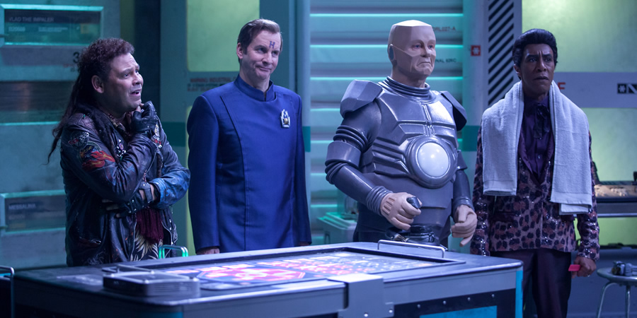 Red Dwarf. Image shows from L to R: Lister (Craig Charles), Rimmer (Chris Barrie), Kryten (Robert Llewellyn), Cat (Danny John-Jules)