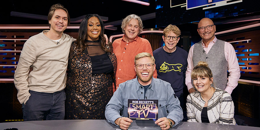 Rob Beckett's Smart TV. Image shows left to right: Joe Thomas, Alison Hammond, Alan Davies, Rob Beckett, Josh Widdicombe, Gregg Wallace, Ruth Madeley