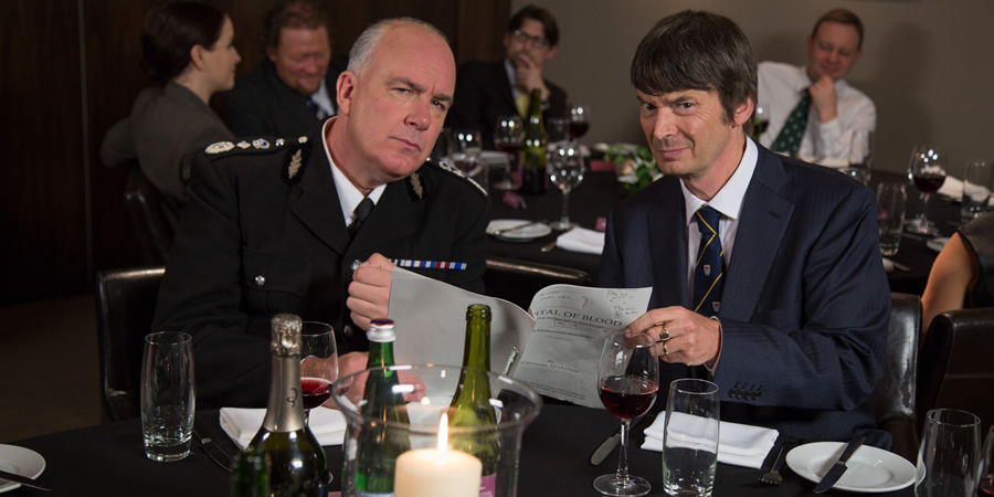 Scot Squad. Image shows from L to R: Chief Commissioner Cameron Miekelson (Jack Docherty), Ian Rankin. Copyright: The Comedy Unit