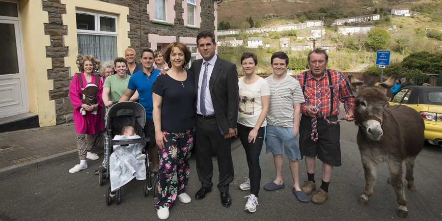 Stella. Image shows from L to R: Nadine (Karen Paullada), Aunty Brenda (Di Botcher), Little Alan (Daniel Gammond), Karl (Julian Lewis Jones), Luke (Craig Gallivan), Bobby (Aled Pugh), Stella (Ruth Jones), Michael Jackson (Patrick Baladi), Cheryl (Clare Hingott), Ben (Justin Davies), Glen Brennig (Dafydd Hywel). Copyright: Tidy Productions