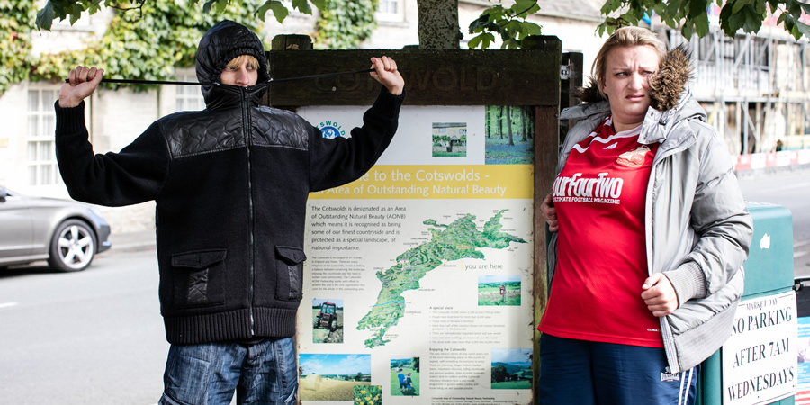 This Country. Image shows from L to R: Lee 'Kurtan' Mucklowe (Charlie Cooper), Kerry Mucklowe (Daisy May Cooper). Copyright: BBC