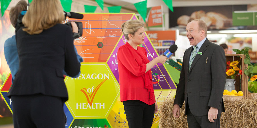 Trollied. Image shows from L to R: Wendy (Olivia Poulet), Gavin (Jason Watkins). Copyright: Roughcut Television