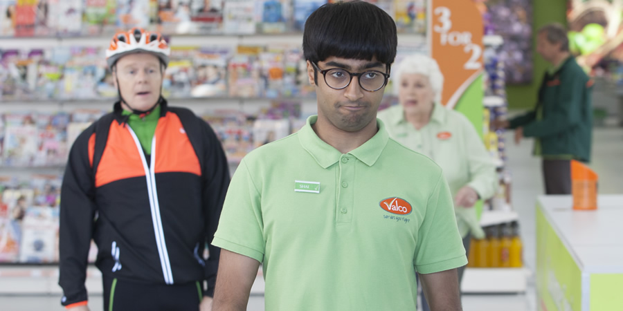 Trollied. Image shows from L to R: Gavin (Jason Watkins), Shai (Nikhil Parmar), Margaret (Rita May). Copyright: Roughcut Television