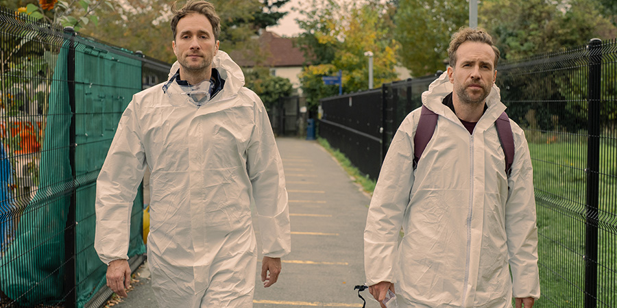 Trying. Image shows from L to R: Freddie (Oliver Chris), Jason Ross (Rafe Spall). Copyright: Apple TV+