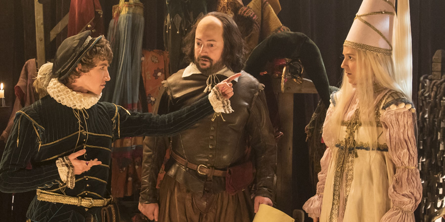 Upstart Crow. Image shows from L to R: Gussie (Dominic Herman Day), Will Shakespeare (David Mitchell), Kate (Gemma Whelan). Copyright: BBC