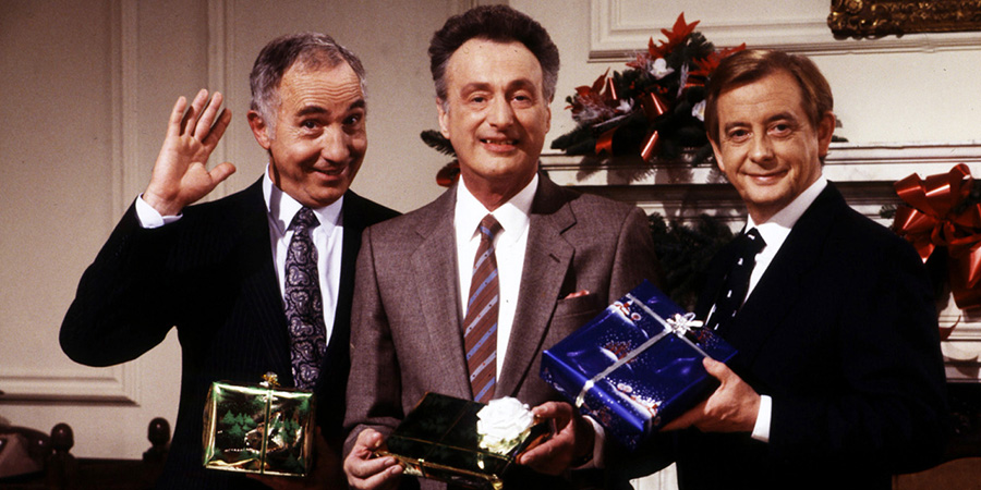 Yes Minister. Image shows left to right: Sir Humphrey Appleby (Nigel Hawthorne), James Hacker (Paul Eddington), Bernard Woolley (Derek Fowlds). Credit: BBC