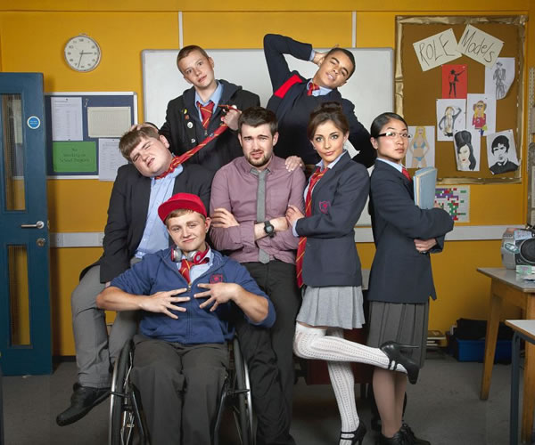 Bad Education. Image shows from L to R: Joe (Ethan Lawrence), Rem Dogg (Jack Binstead), Mitchell (Charlie Wernham), Alfie (Jack Whitehall), Stephen (Layton Williams), Chantelle (Nikki Runeckles), Jing (Kae Alexander). Copyright: Tiger Aspect Productions