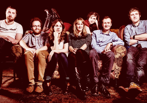 Here Be Dragons. Image shows from L to R: Lloyd Langford, Gareth Gwynn, Cariad Lloyd, Sian Harries, Nadia Kamil, Benjamin Partridge, Elis James. Copyright: John Stanley Productions