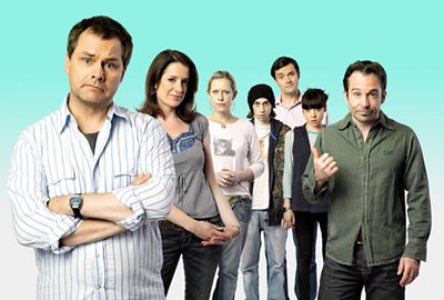 Lead Balloon. Image shows from L to R: Rick Spleen (Jack Dee), Mel (Raquel Cassidy), Magda (Anna Crilly), Ben (Rasmus Hardiker), Michael (Tony Gardner), Sam (Antonia Campbell-Hughes), Marty (Sean Power). Copyright: Open Mike Productions