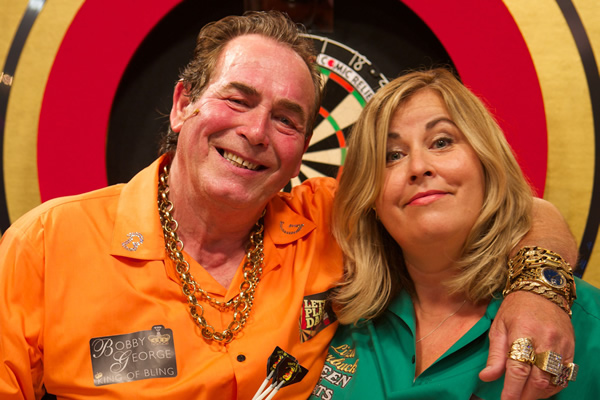 Let's Play Darts. Image shows from L to R: Bobby George, Liza Tarbuck. Copyright: Zeppotron