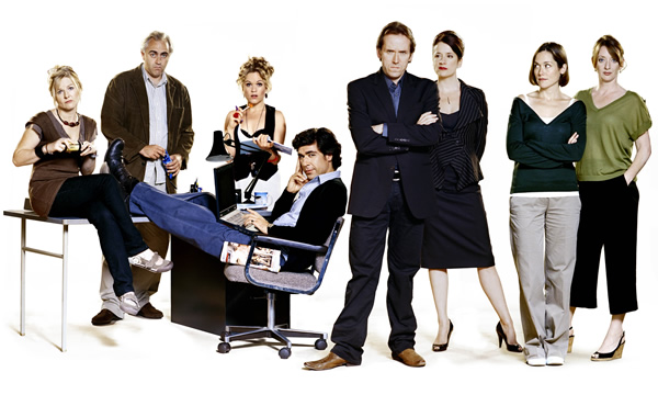 Moving Wallpaper. Image shows from L to R: Gillian McGovern (Sarah Hadland), Carl Morris (Dave Lamb), Kelly Hawkins (Sinead Keenan), Tom Warren (James Lance), Jonathan Pope (Ben Miller), Nancy Weeks (Raquel Cassidy), Sam Phillips (Lucy Liemann), Mel Debrou (Elizabeth Berrington). Copyright: Kudos Productions / Red Planet Pictures