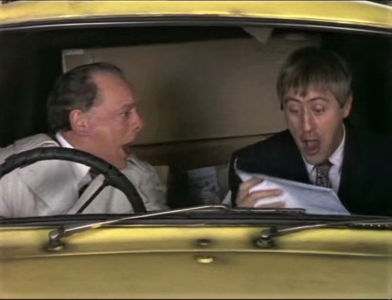 Del and Rodney read the invoice from their Sotheby's sale. Image shows left to right: Del (David Jason), Rodney (Nicholas Lyndhurst). Credit: BBC